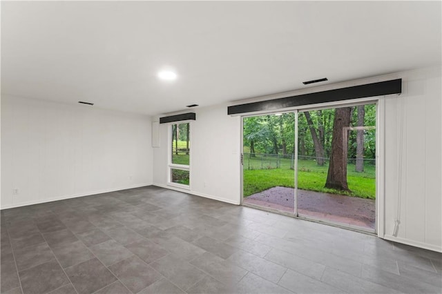 804 5th St, Baldwin City, KS 66006 - unfurnished room featuring healthy amount of natural light and baseboards