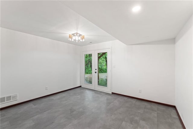 804 5th St, Baldwin City, KS 66006 - unfurnished room with baseboards and a chandelier