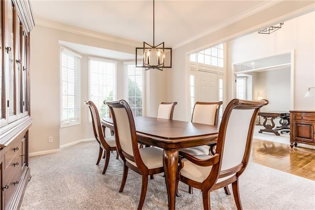 13310 W 129th St, Overland Park, KS 66213 - dining space with ornamental molding, a chandelier, light colored carpet, and baseboards