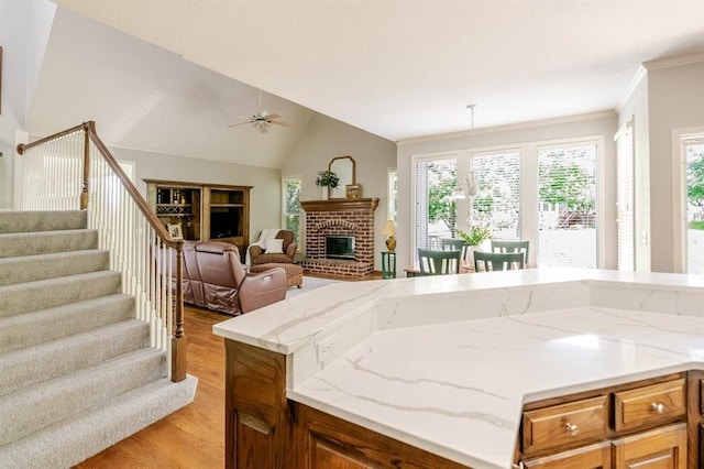 13310 W 129th St, Overland Park, KS 66213 - kitchen with light wood-style floors, open floor plan, a ceiling fan, plenty of natural light, and lofted ceiling