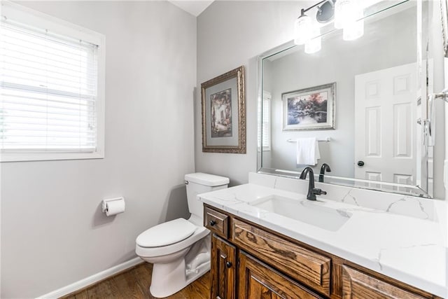 13310 W 129th St, Overland Park, KS 66213 - bathroom featuring toilet, wood finished floors, vanity, and baseboards