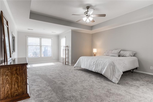 13310 W 129th St, Overland Park, KS 66213 - carpeted bedroom featuring a tray ceiling, baseboards, ornamental molding, and a ceiling fan