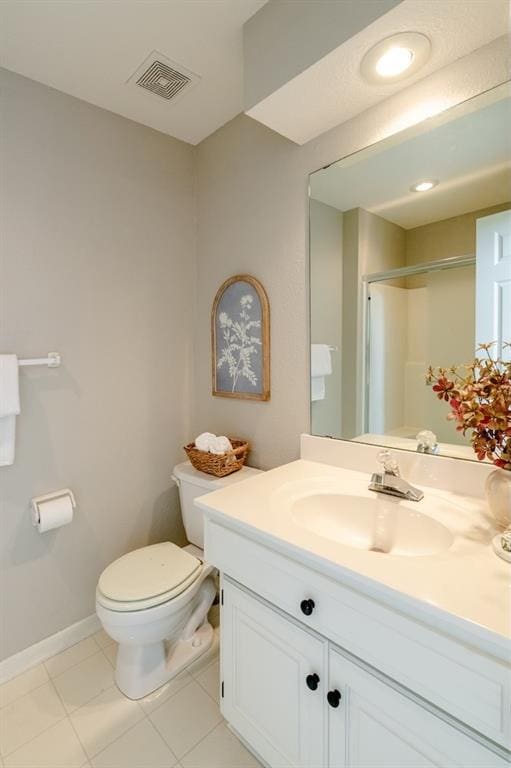 13310 W 129th St, Overland Park, KS 66213 - bathroom featuring toilet, vanity, a shower, and tile patterned floors