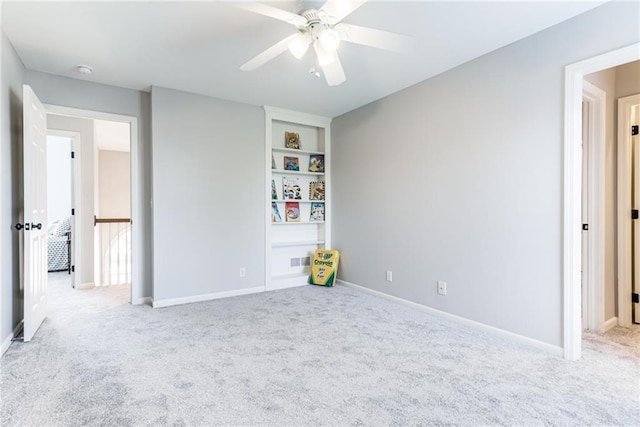13310 W 129th St, Overland Park, KS 66213 - carpeted empty room with ceiling fan, built in shelves, and baseboards