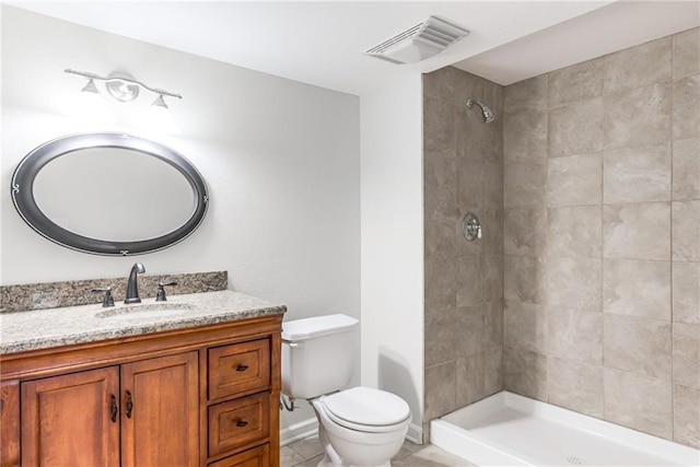 13310 W 129th St, Overland Park, KS 66213 - full bathroom featuring toilet, vanity, a tile shower, and tile patterned floors
