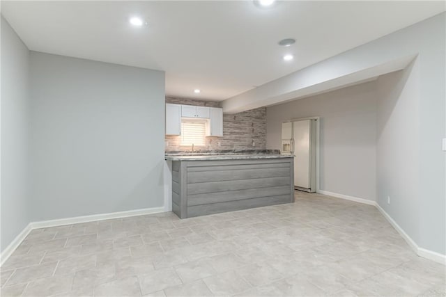 13310 W 129th St, Overland Park, KS 66213 - unfurnished living room with recessed lighting, baseboards, and a sink