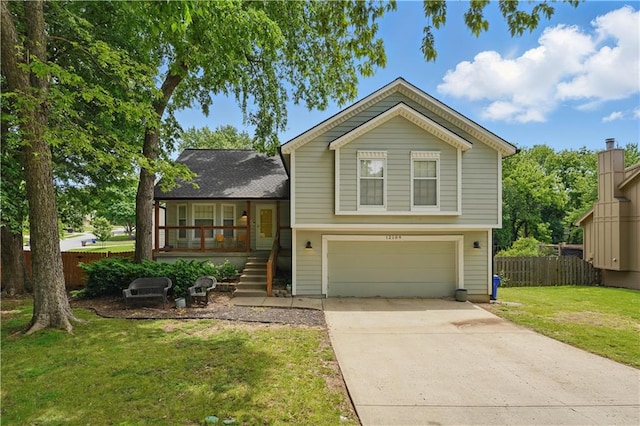 12109 S Acuff Ln, Olathe, KS 66062 - split level home with covered porch, an attached garage, stairway, and driveway