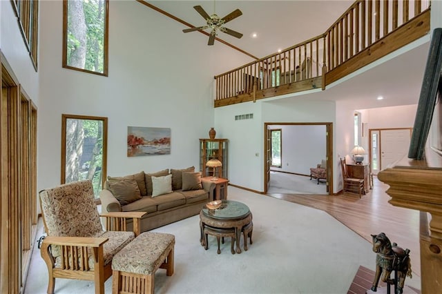 5317 NW Bluff Way, Parkville, MO 64152 - carpeted living room with a high ceiling, ceiling fan, and recessed lighting