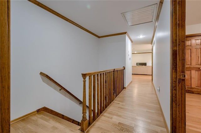 5317 NW Bluff Way, Parkville, MO 64152 - corridor featuring an upstairs landing, light wood-style flooring, ornamental molding, baseboards, and recessed lighting