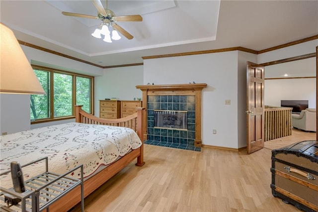 5317 NW Bluff Way, Parkville, MO 64152 - bedroom with a raised ceiling, light wood-style flooring, crown molding, and baseboards