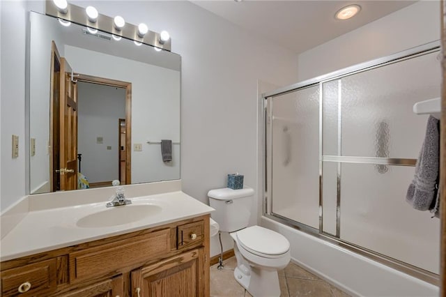 5317 NW Bluff Way, Parkville, MO 64152 - bathroom featuring vanity, toilet, combined bath / shower with glass door, and tile patterned floors