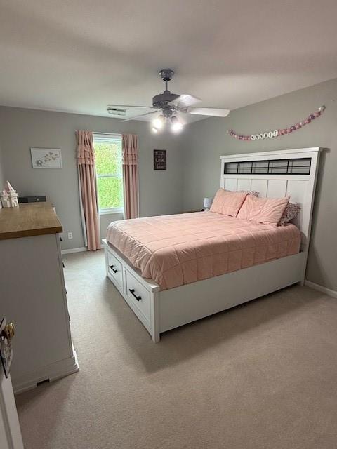 5604 Pleasant Ave, Saint Joseph, MO 64503 - bedroom with light carpet, baseboards, and ceiling fan
