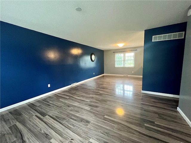 1 N Vine View St, Platte City, MO 64079 - unfurnished room with baseboards, wood finished floors, and a textured ceiling