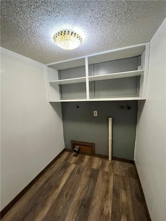 1 N Vine View St, Platte City, MO 64079 - laundry area featuring wood finished floors, a textured ceiling, hookup for an electric dryer, and baseboards