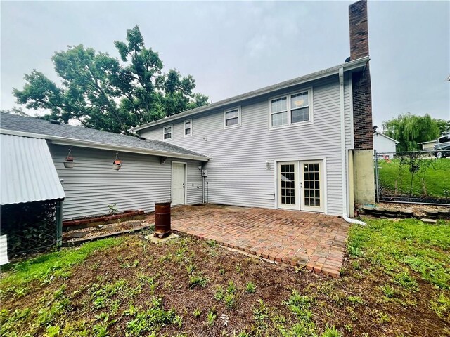 1 N Vine View St, Platte City, MO 64079 - rear view of house featuring a patio, a chimney, and french doors