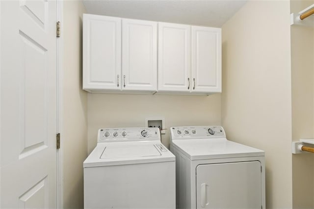 15050 W 145th St, Olathe, KS 66062 - laundry area featuring washer and dryer and cabinet space