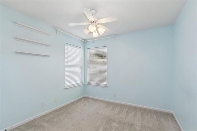 15050 W 145th St, Olathe, KS 66062 - empty room featuring carpet floors, baseboards, and ceiling fan