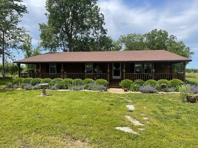 4691 New Hampshire Rd, Bronson, KS 66716 - view of front of home with a porch and a front lawn