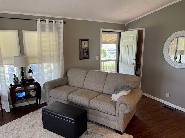 4691 New Hampshire Rd, Bronson, KS 66716 - living area featuring ornamental molding, wood finished floors, and baseboards