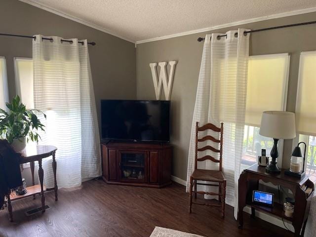 4691 New Hampshire Rd, Bronson, KS 66716 - living area with ornamental molding, wood finished floors, and a textured ceiling