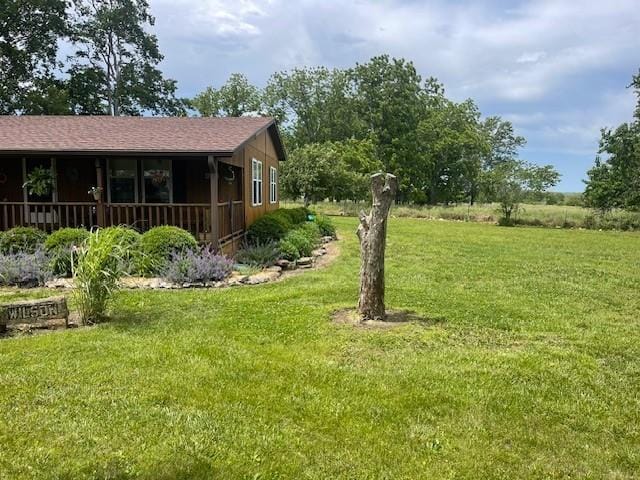 4691 New Hampshire Rd, Bronson, KS 66716 - view of green lawn with covered porch