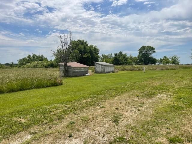 4691 New Hampshire Rd, Bronson, KS 66716 - view of grassy yard with an outdoor structure