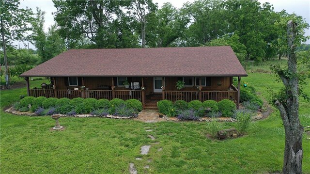 4691 New Hampshire Rd, Bronson, KS 66716 - view of front of home featuring covered porch and a front lawn