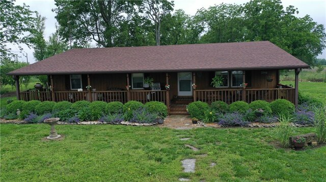 4691 New Hampshire Rd, Bronson, KS 66716 - view of front of home featuring a front yard and covered porch