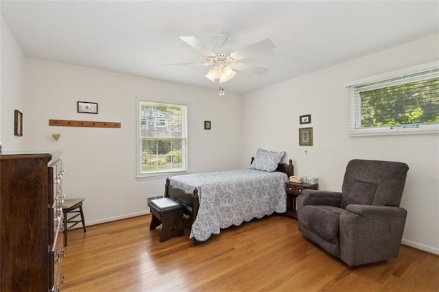 5407 W 64th Ter, Prairie Village, KS 66208 - bedroom with light wood-style flooring, baseboards, and a ceiling fan