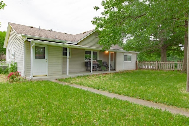 7610 NE Bacon Rd, Cameron, MO 64429 - back of house with a patio and roof with shingles