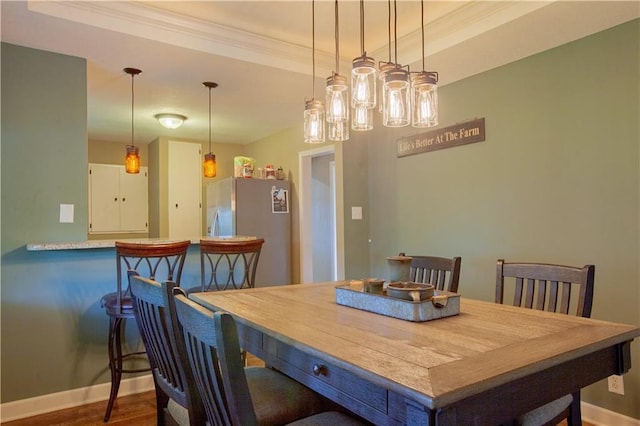 7610 NE Bacon Rd, Cameron, MO 64429 - dining area with baseboards, ornamental molding, wood finished floors, and a tray ceiling