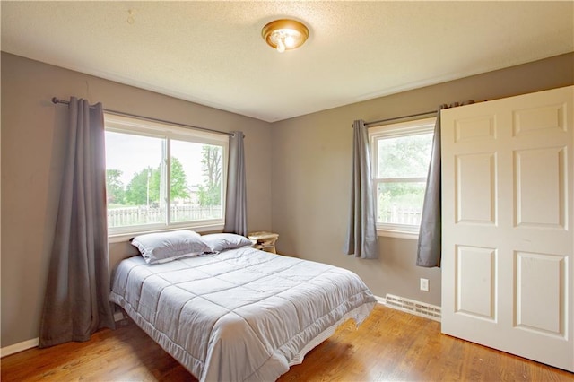 7610 NE Bacon Rd, Cameron, MO 64429 - bedroom featuring light wood finished floors and baseboards