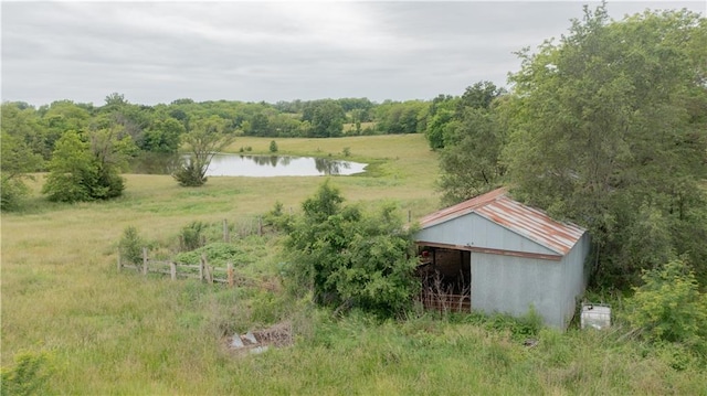 7610 NE Bacon Rd, Cameron, MO 64429 - water view featuring an outbuilding