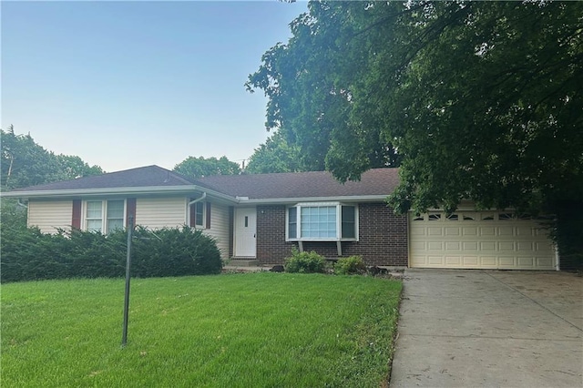 1923 Seneca St, Leavenworth, KS 66048 - single story home with concrete driveway, a garage, a front yard, and brick siding