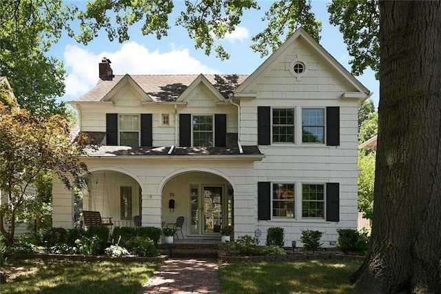35 W 70th St, Kansas City, MO 64113 - view of front facade featuring a porch, a chimney, and a shingled roof
