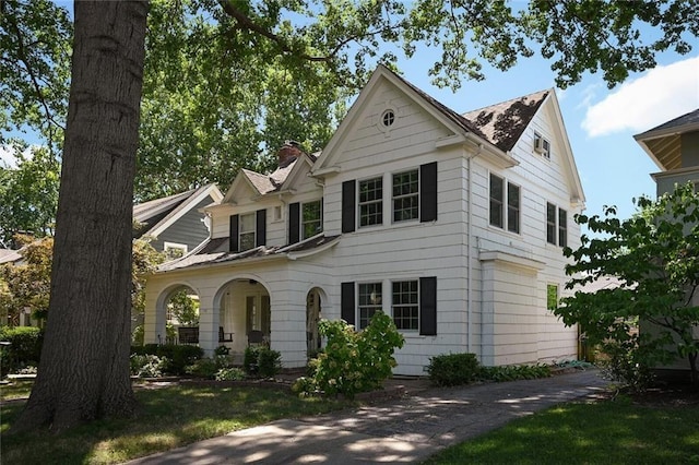 35 W 70th St, Kansas City, MO 64113 - view of front facade with a chimney
