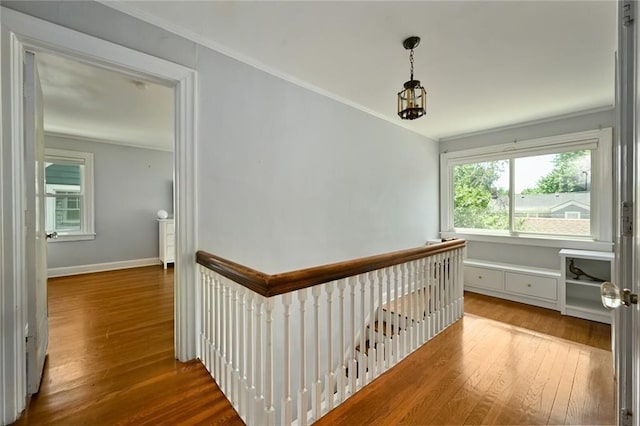 35 W 70th St, Kansas City, MO 64113 - corridor with hardwood / wood-style flooring, an upstairs landing, and ornamental molding