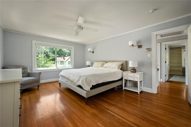 35 W 70th St, Kansas City, MO 64113 - bedroom with ornamental molding, wood finished floors, and ceiling fan