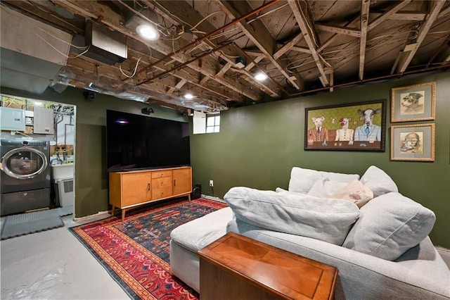 35 W 70th St, Kansas City, MO 64113 - living area featuring washer / clothes dryer and finished concrete flooring