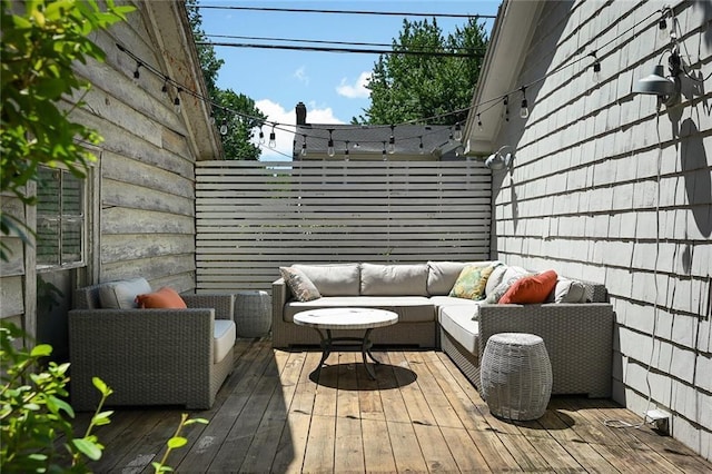 35 W 70th St, Kansas City, MO 64113 - wooden deck with outdoor lounge area