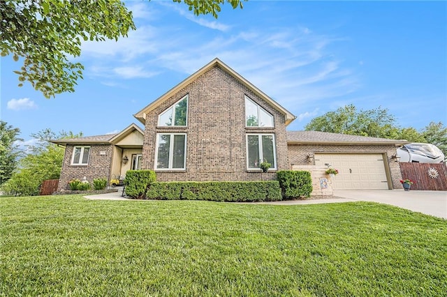15417 Poplar St, Basehor, KS 66007 - view of front of house with brick siding, concrete driveway, and an attached garage