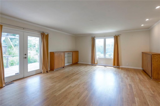 8811 W 66th Ter, Mission, KS 66202 - unfurnished room featuring healthy amount of natural light, french doors, crown molding, light wood-style flooring, and baseboards