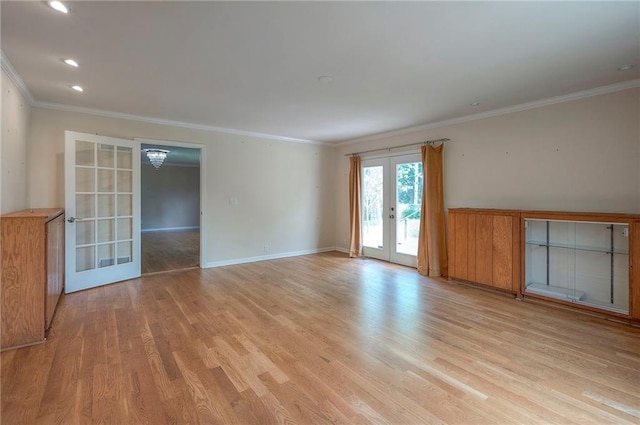 8811 W 66th Ter, Mission, KS 66202 - spare room featuring french doors, light wood-style floors, ornamental molding, and baseboards