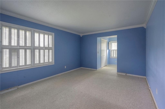 8811 W 66th Ter, Mission, KS 66202 - carpeted spare room featuring crown molding, baseboards, a textured ceiling, and baseboard heating