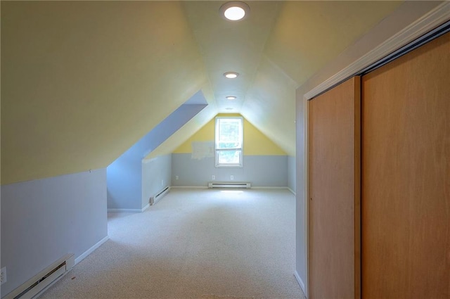 8811 W 66th Ter, Mission, KS 66202 - additional living space with a baseboard heating unit, vaulted ceiling, carpet, recessed lighting, and baseboards