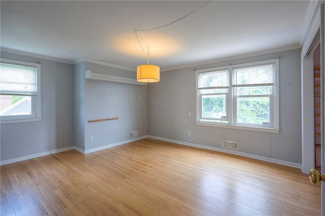 8811 W 66th Ter, Mission, KS 66202 - spare room with light wood-style floors, crown molding, and baseboards