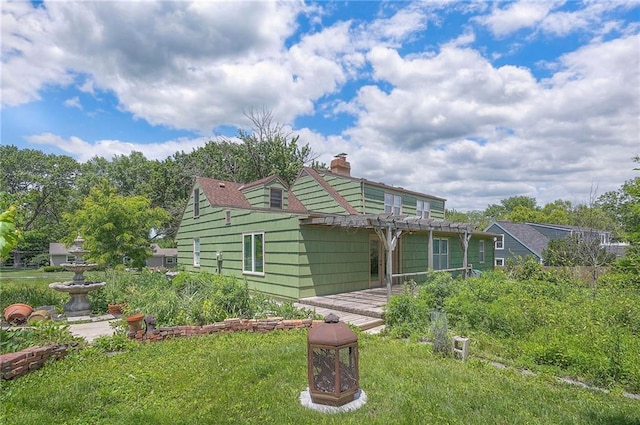8811 W 66th Ter, Mission, KS 66202 - rear view of house with a chimney, a pergola, and a patio