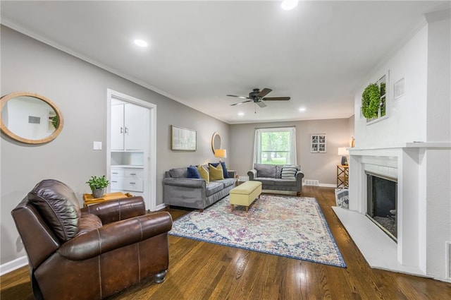 10100 E Sheley Rd, Independence, MO 64052 - living room featuring ceiling fan, ornamental molding, wood finished floors, baseboards, and recessed lighting
