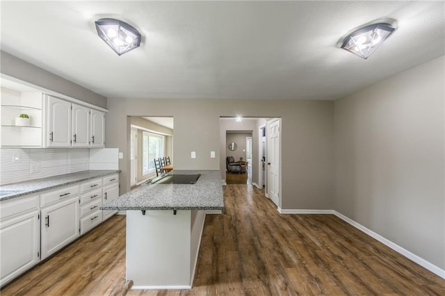 10100 E Sheley Rd, Independence, MO 64052 - kitchen with white cabinets, open shelves, tasteful backsplash, and dark wood-style flooring