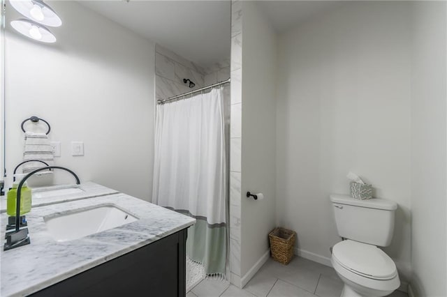 10100 E Sheley Rd, Independence, MO 64052 - bathroom with tile patterned flooring, double vanity, toilet, and tiled shower